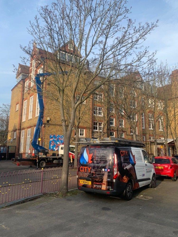 Cherry picker access for high-level gutters