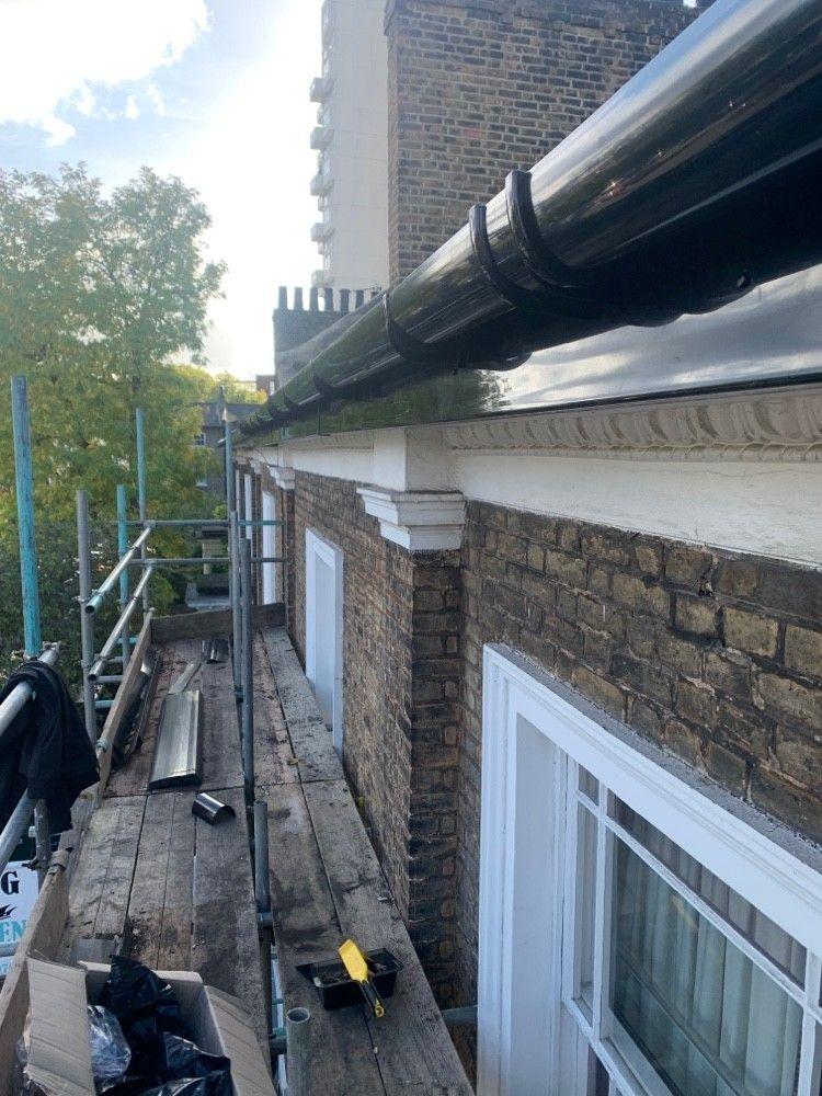 New guttering on a terrace, from scaffold